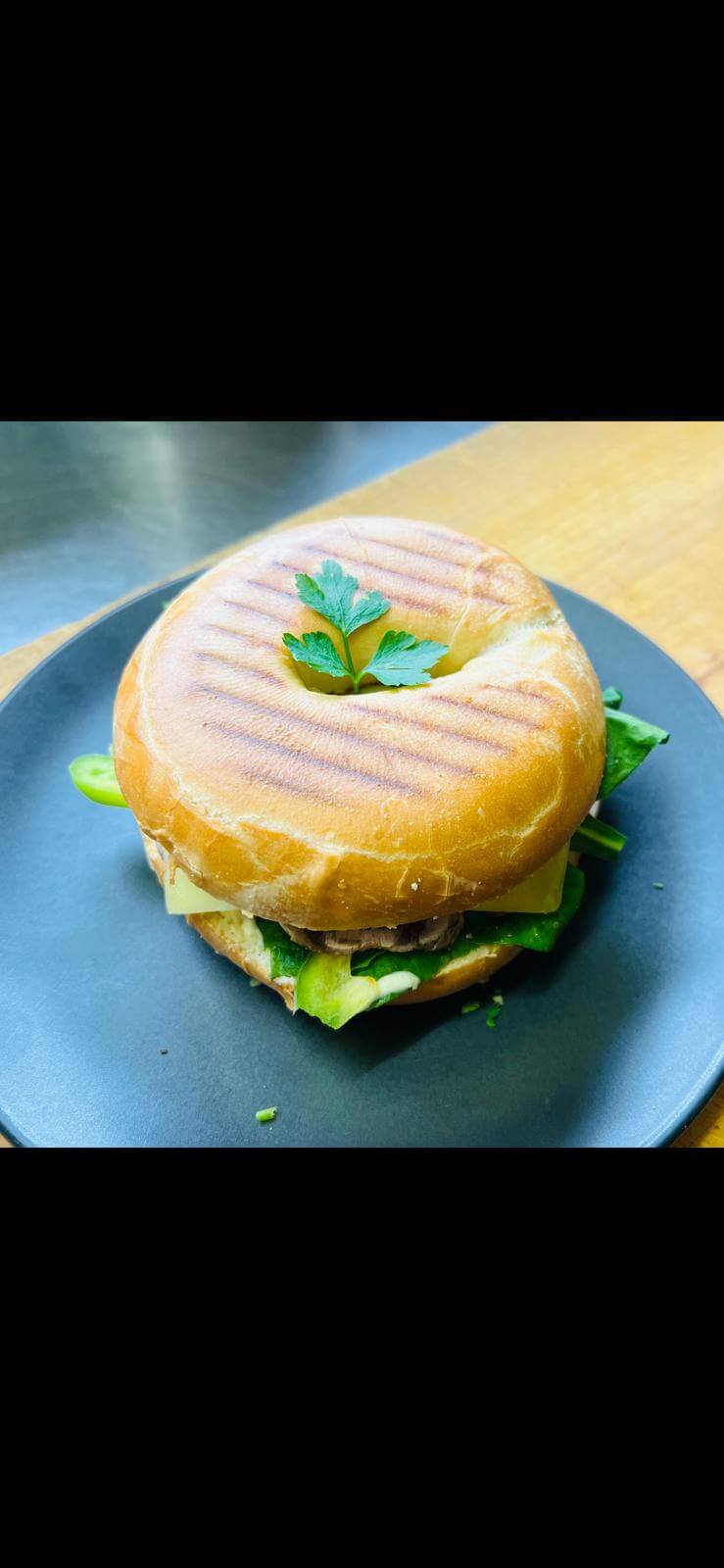 Toasted Bagel with Cream Cheese, Herbs, and Fresh Vegetables